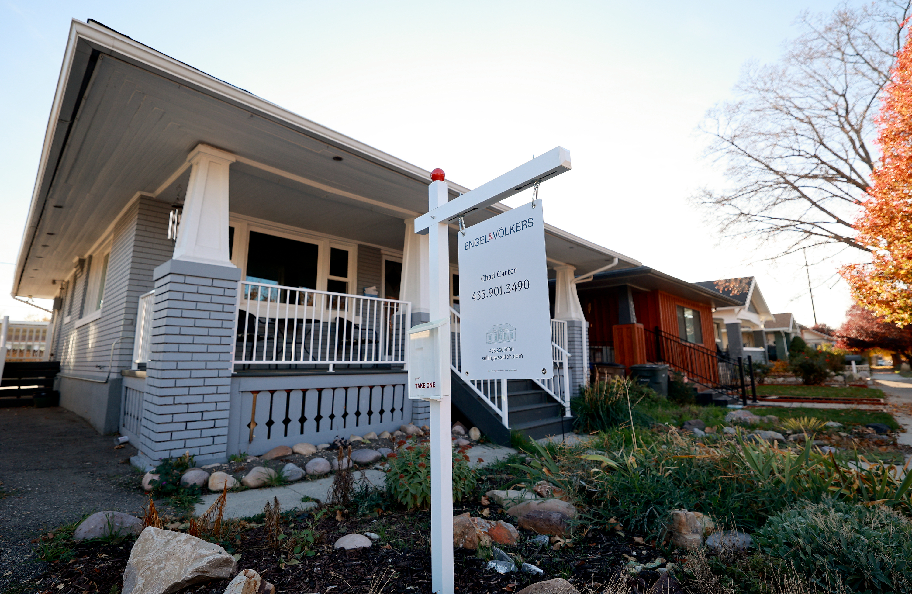 A for-sale sign is pictured outside a house in Salt Lake City on Nov. 11.