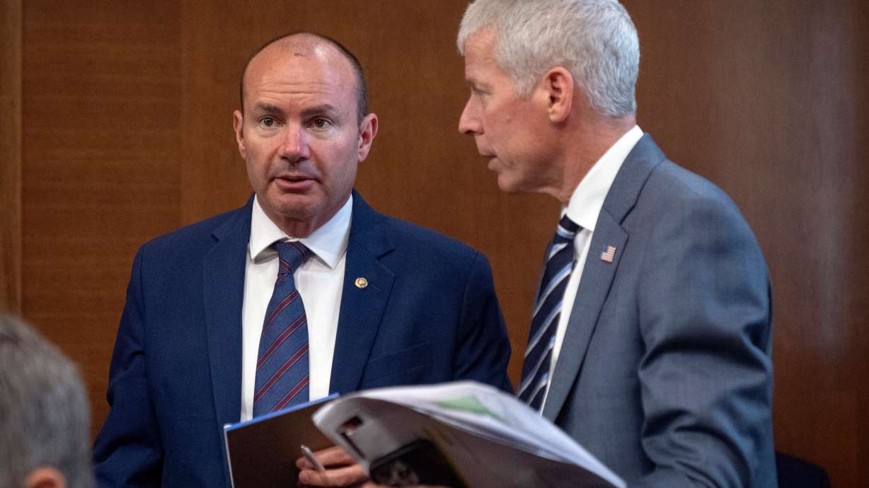 Energy Secretary Chris Wright, right, talks with Sen. Mike Lee, R-Utah, left, before a hearing of the Senate Committee on Energy and Natural Resources on Capitol Hill, June 18, in Washington.