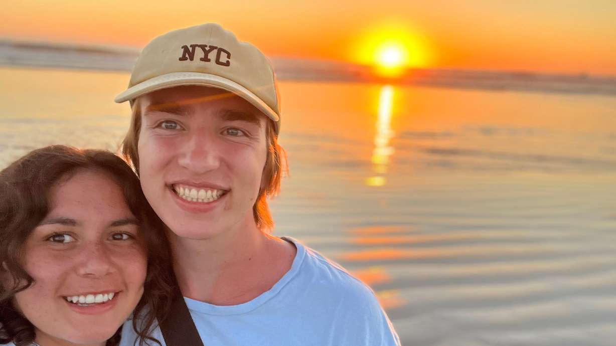 Katie and Gavin Cornia take a selfie in Hawaii in October 2023. The Cornias were in a car accident in November that killed Gavin Cornia and injured Katie Cornia. Now, BYU and Texas Tech fans are donating to help the family.