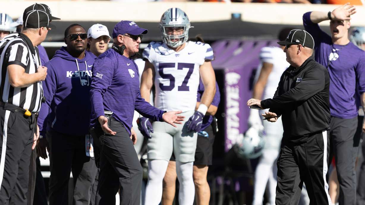 Kansas State head coach Chris Klieman talks to officials on the sidelines in the first half of an NCAA college football game against Oklahoma State Saturday, Nov. 15, 2025, in Stillwater, Okla.