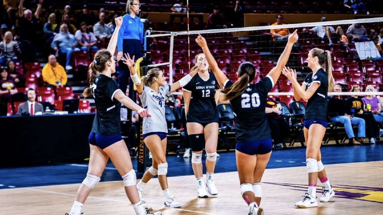 Utah State celebrates after a point during its five-set win over Tennessee in the first round of the NCAA Tournament on Thursday in Tempe, Arizona.