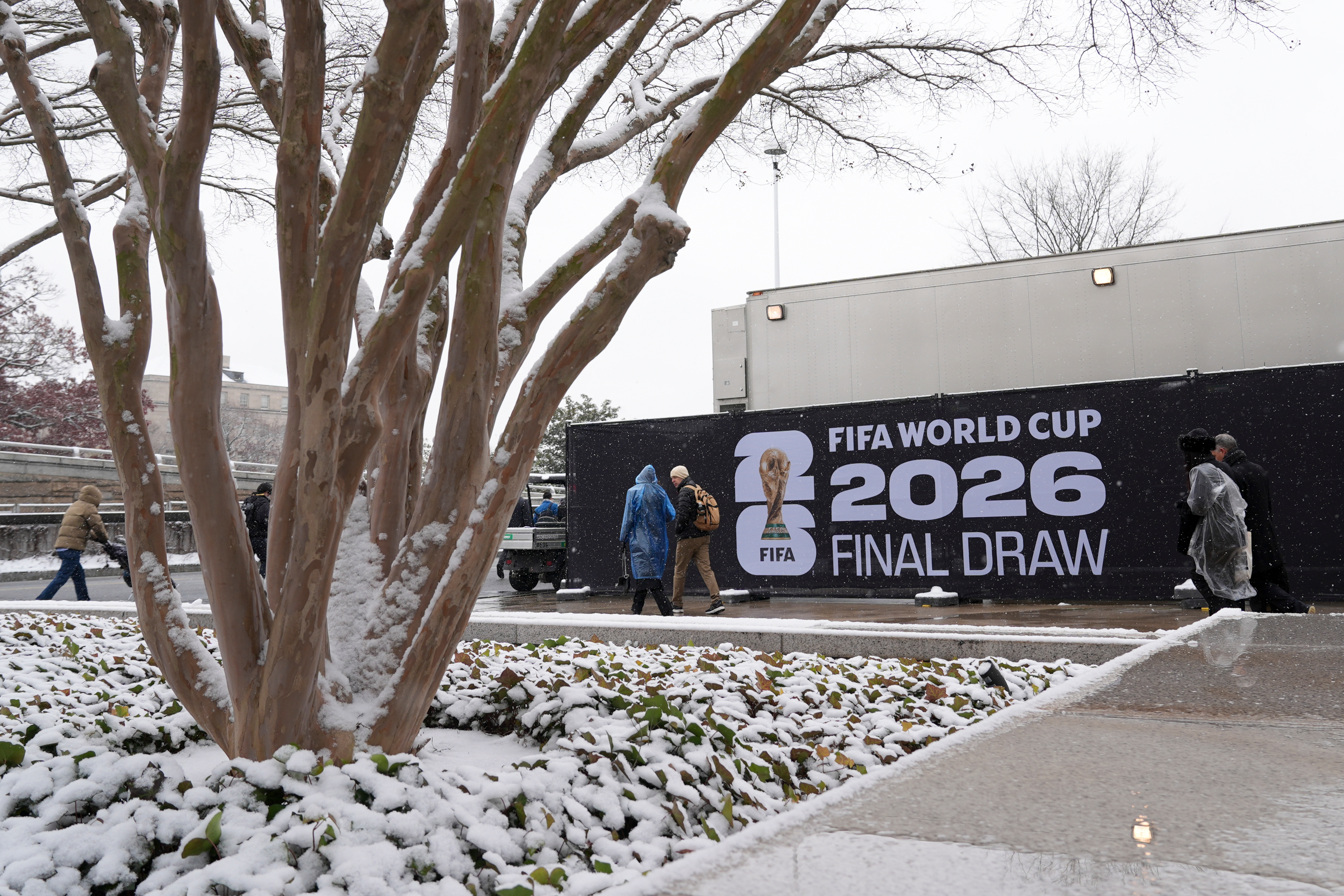 People arrive for the draw for the 2026 soccer World Cup at the Kennedy Center in Washington, Friday, Dec. 5, 2025.