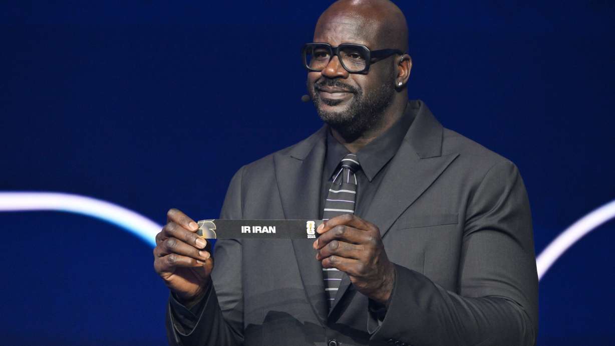 Former NBA player Shaquille O'Neal holds up Iran after drawing from a pot during the draw for the 2026 soccer World Cup at the Kennedy Center in Washington, Friday, Dec. 5, 2025.