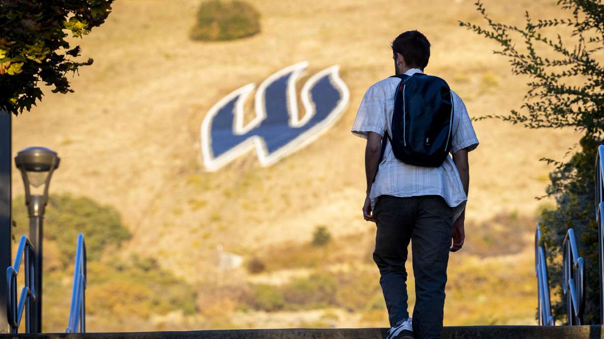 A student walks toward the “W” near the campus of Weber State University in Ogden on Oct. 1. Censorship has reemerged at WSU after an author pulled out of a speaking engagement over "prohibited words and concepts."