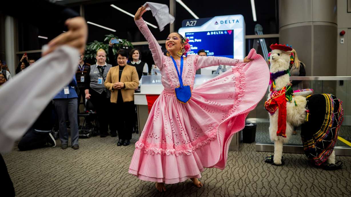 Kylee Dos Santos, 10, dances before Delta’s maiden flight from Salt Lake City to Lima, Peru, operating daily seasonal service using a Boeing 767-300ER until Jan. 25, 2026, at the Salt Lake City International Airport in Salt Lake City on Thursday.