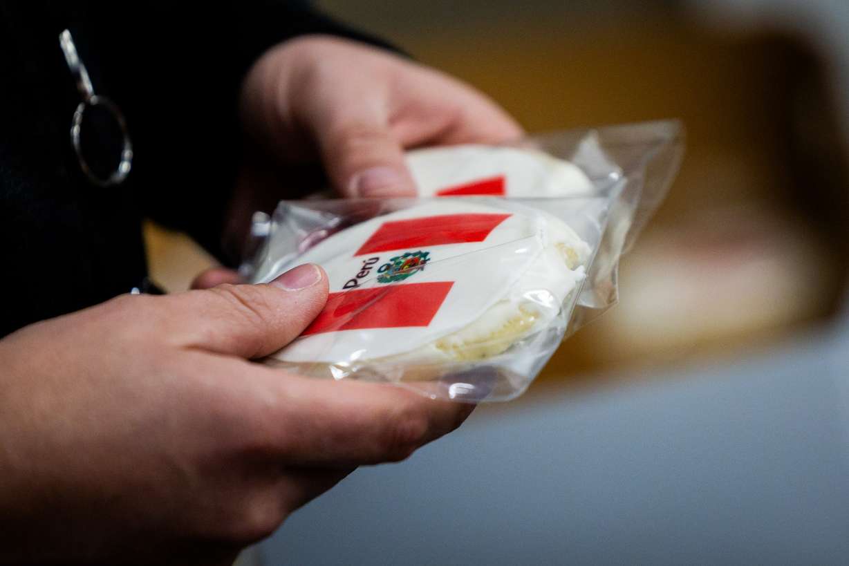 Cookies with the flag of Peru are handed to people boarding Delta’s maiden flight from Salt Lake City to Lima, Peru, operating daily seasonal service using a Boeing 767-300ER until Jan. 25, 2026, at the Salt Lake City International Airport in Salt Lake City on Thursday. Airport Executive Director Bill Wyatt called the new nonstop route a reflection of the investment in Utah's market.