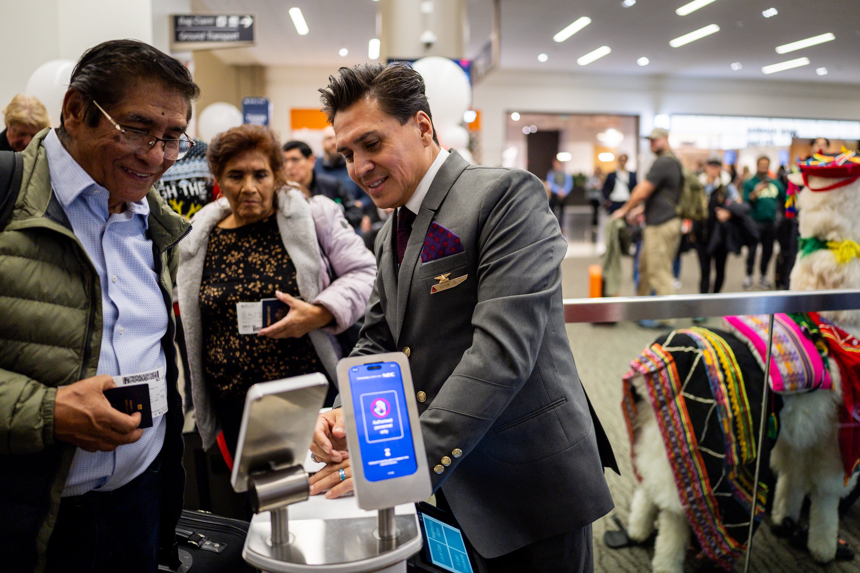 Victor Avalos, customer service agent, right, helps people board Delta’s maiden flight from Salt Lake City to Lima, Peru, operating daily seasonal service using a Boeing 767-300ER until Jan. 25, 2026, at the Salt Lake City International Airport in Salt Lake City on Thursday. The flight also carried a Utah trade delegation to Lima.