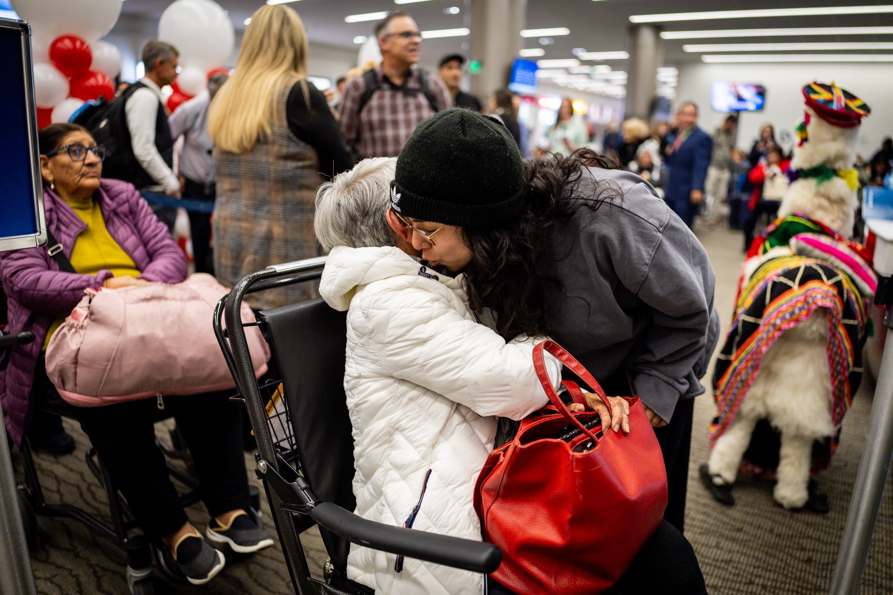 Mary Alban, from Salt Lake City, right, kisses her grandmother Alicia Bocanegra, from Lima, Peru, left, goodbye as Bocanegra boards Delta’s maiden flight from Salt Lake City to Lima, Peru, operating daily seasonal service using a Boeing 767-300ER until Jan. 25, 2026, at the Salt Lake City International Airport in Salt Lake City on Thursday. Bocanegra visited Alban in Salt Lake City for three months.
