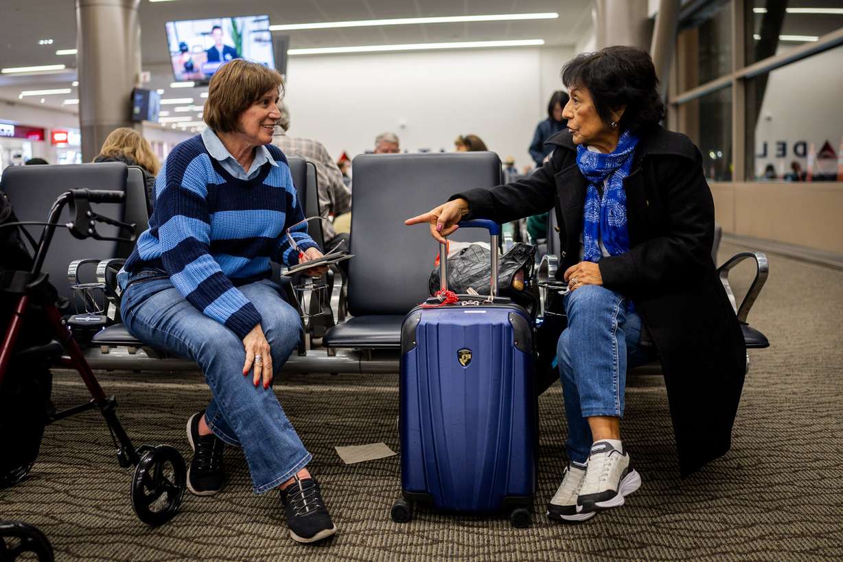 Emma Ugarelli, left, and Ana Ghazaghian, right, wait to board Delta’s maiden flight from Salt Lake City to Lima, Peru, operating daily seasonal service using a Boeing 767-300ER until Jan. 25, 2026, at the Salt Lake City International Airport in Salt Lake City on Thursday.