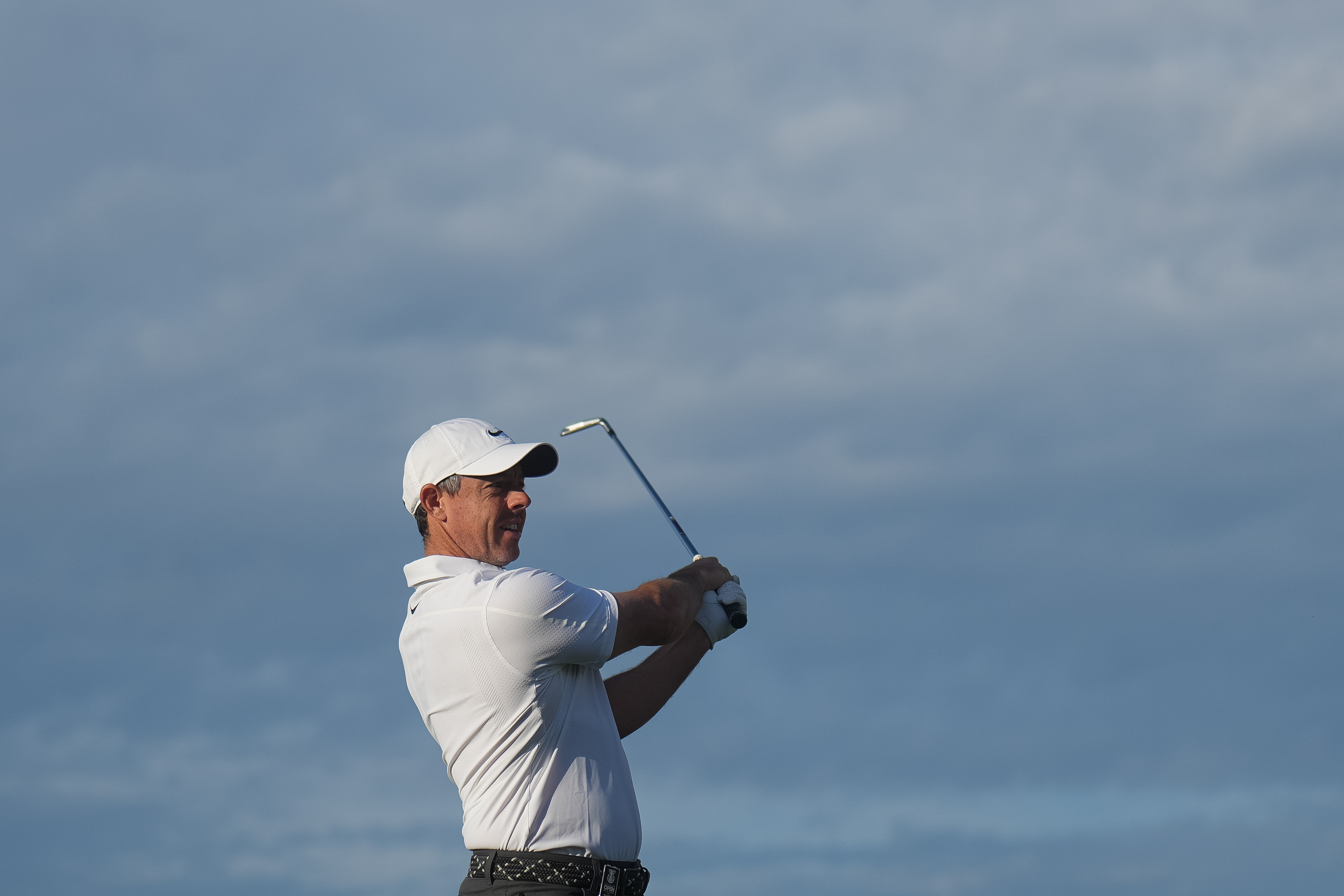 Rory McIlroy of Northern Ireland plays an approach shot on the 10th hole during the first round of the Australian Open golf tournament in Melbourne, Australia, Thursday, Dec. 4, 2025.