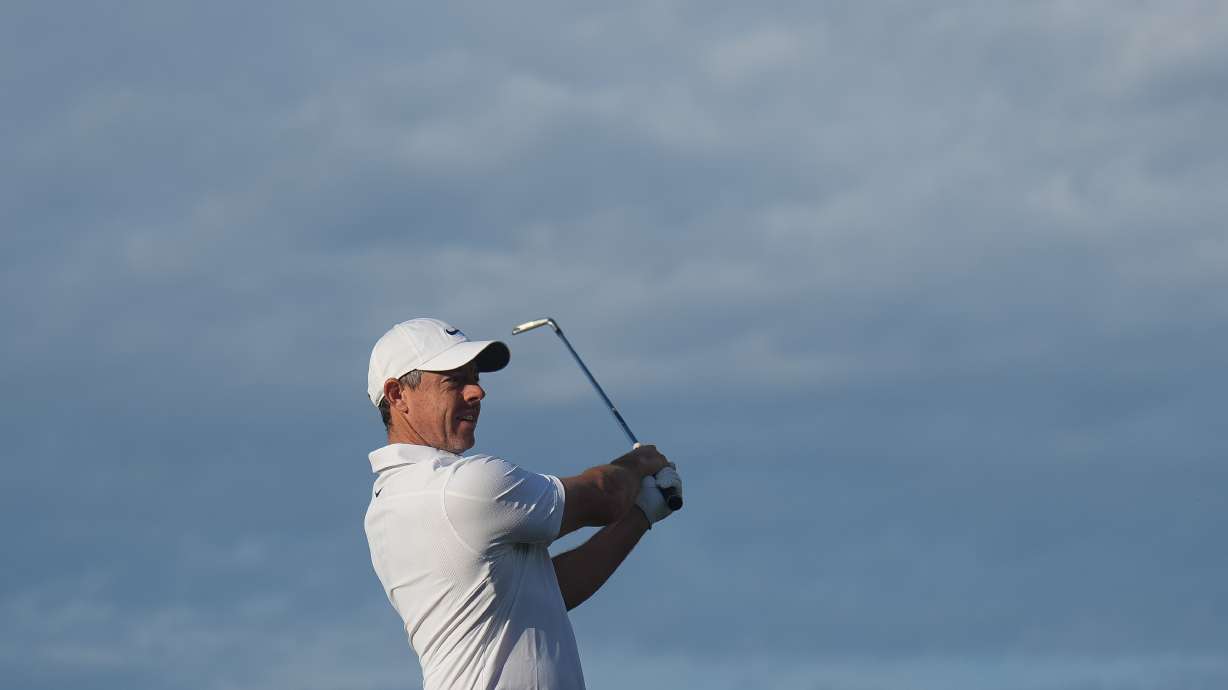 Rory McIlroy of Northern Ireland plays an approach shot on the 10th hole during the first round of the Australian Open golf tournament in Melbourne, Australia, Thursday, Dec. 4, 2025.