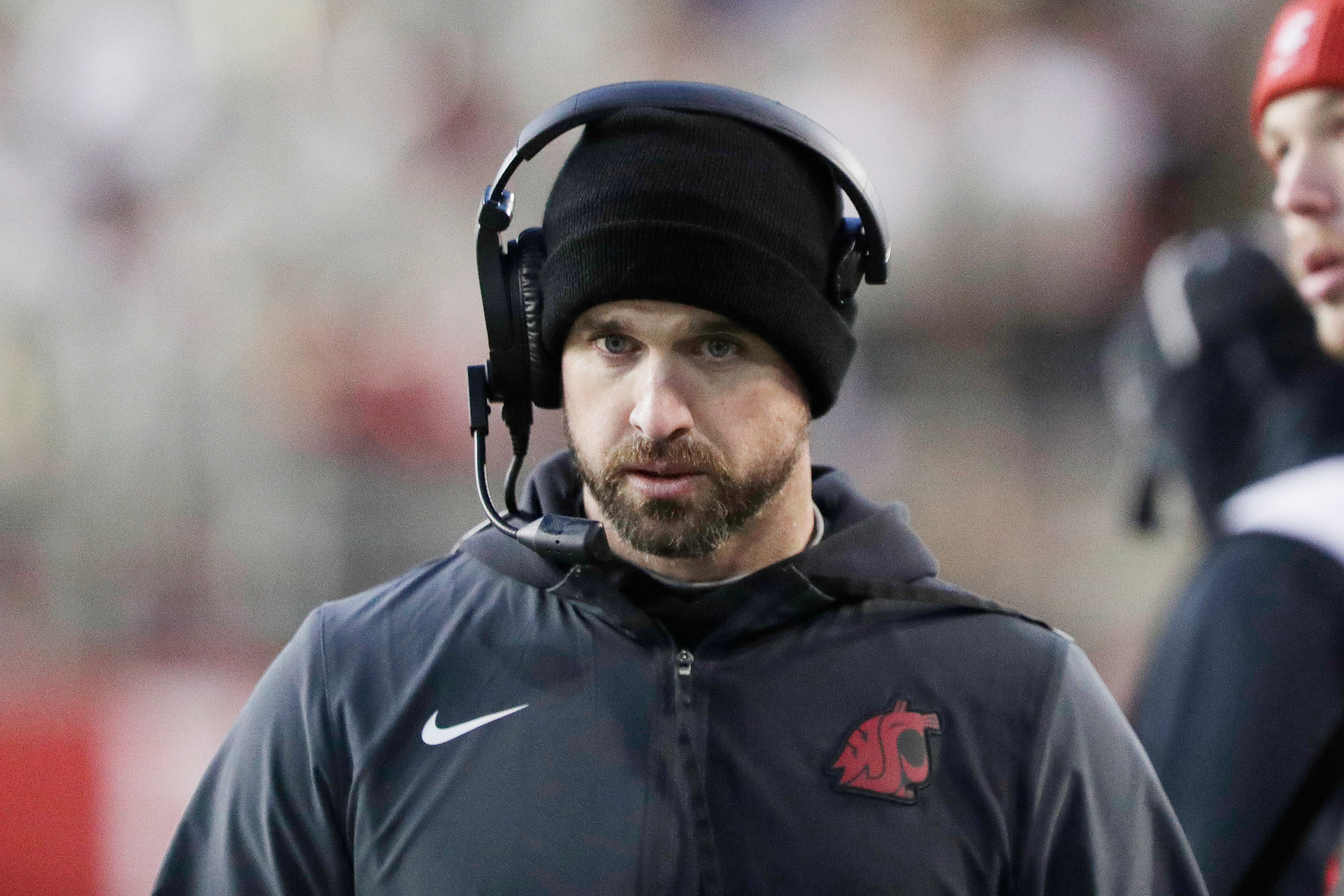 Washington State head coach Jimmy Rogers walks on the sideline during the first half of an NCAA college football game against Oregon State, Saturday, Nov. 29, 2025, in Pullman, Wash.