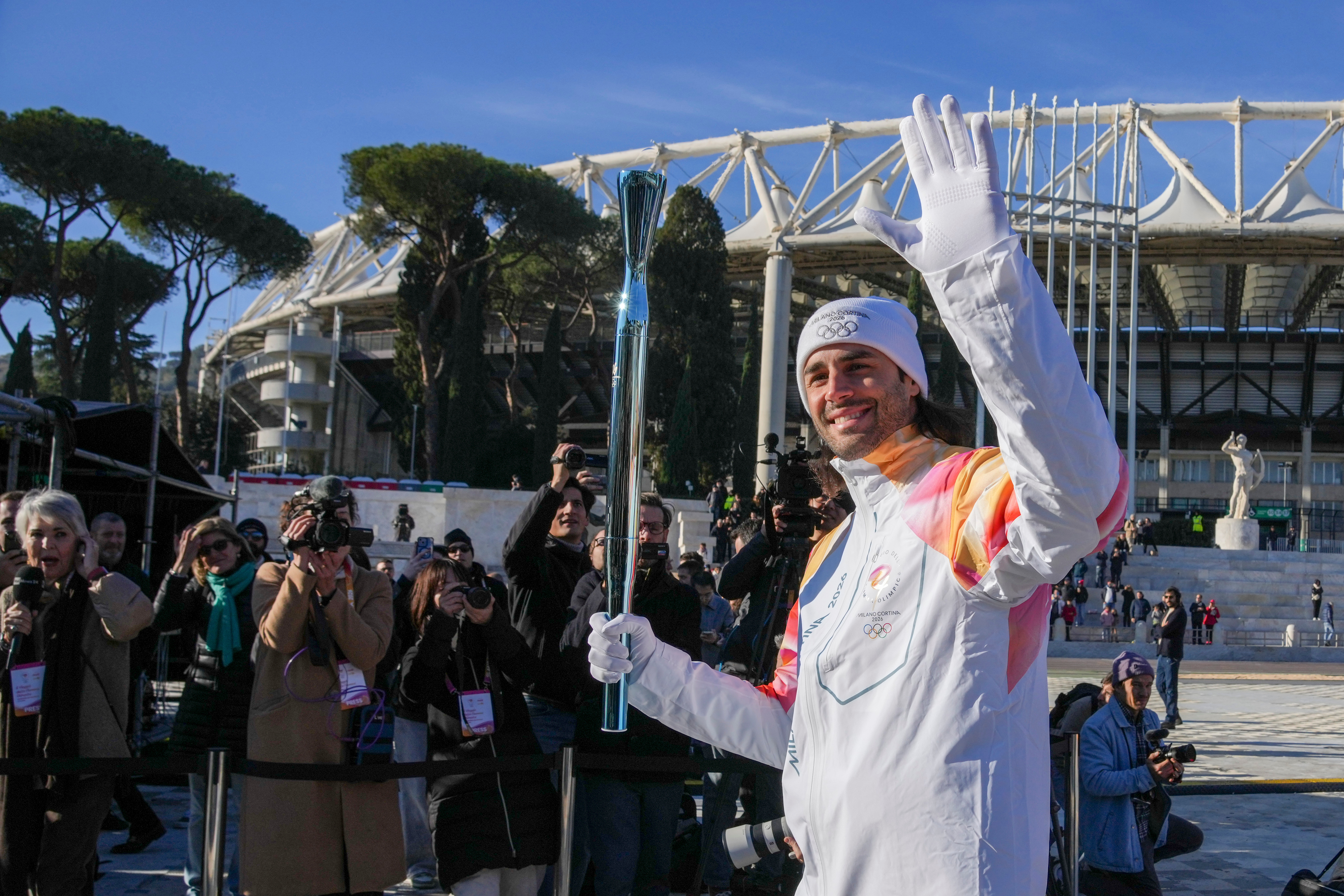 Torch relay for Milan Cortina Winter Olympics starts on 2-month countdown to opening ceremony