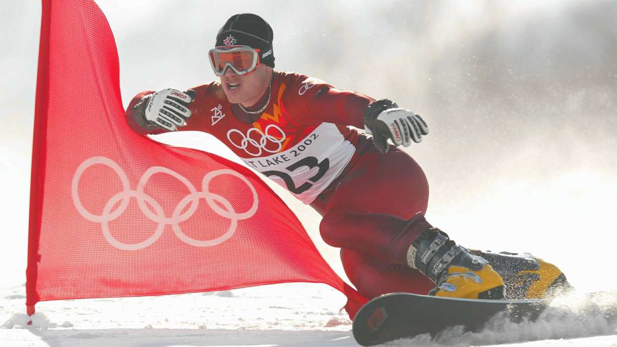 Ryan Wedding competes in the qualifying round of the men's parallel giant slalom snowboarding event during the Salt Lake City Winter Olympic Games in February 2002. Wedding is now one of the FBI's most-wanted fugitives.