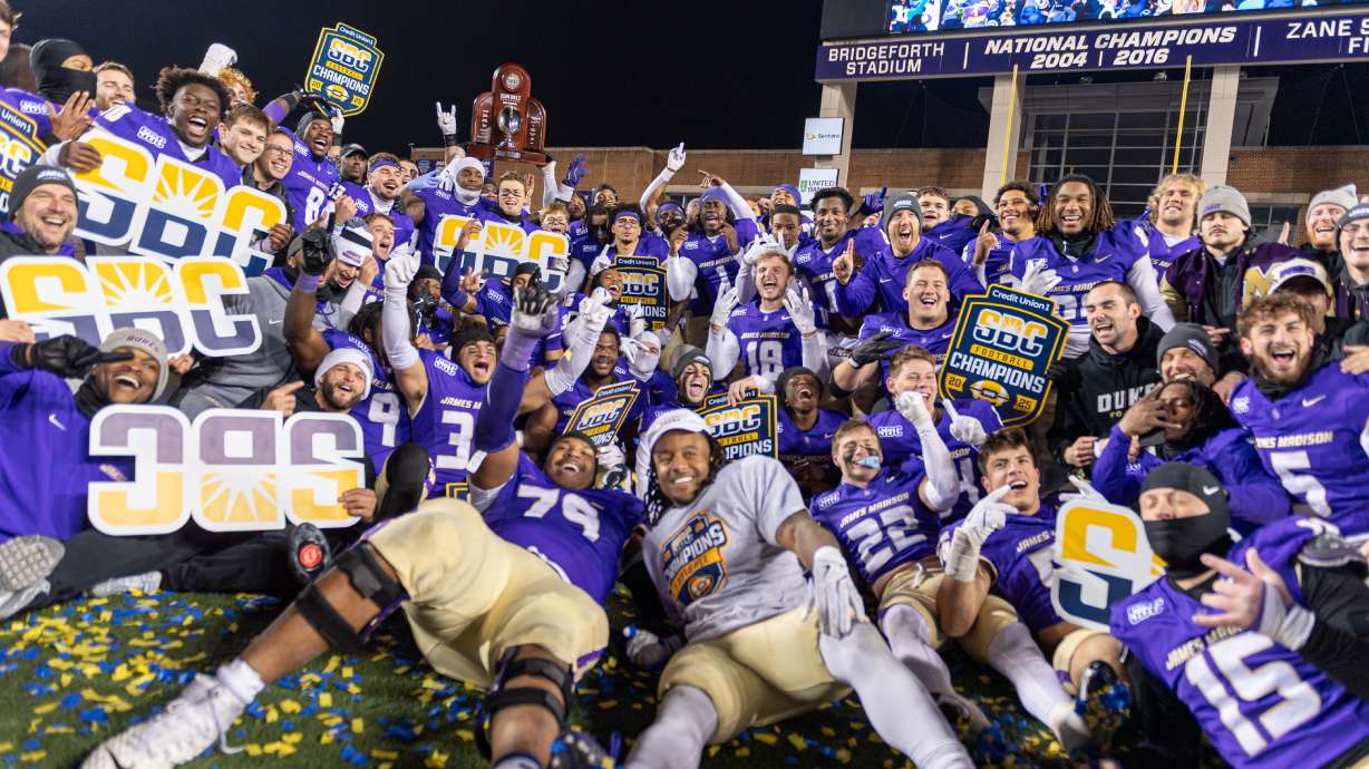 James Madison team celebrates after winning the Sun Belt championship NCAA college football game against Troy, Friday, Dec. 5, 2025, in Harrisonburg, Va.