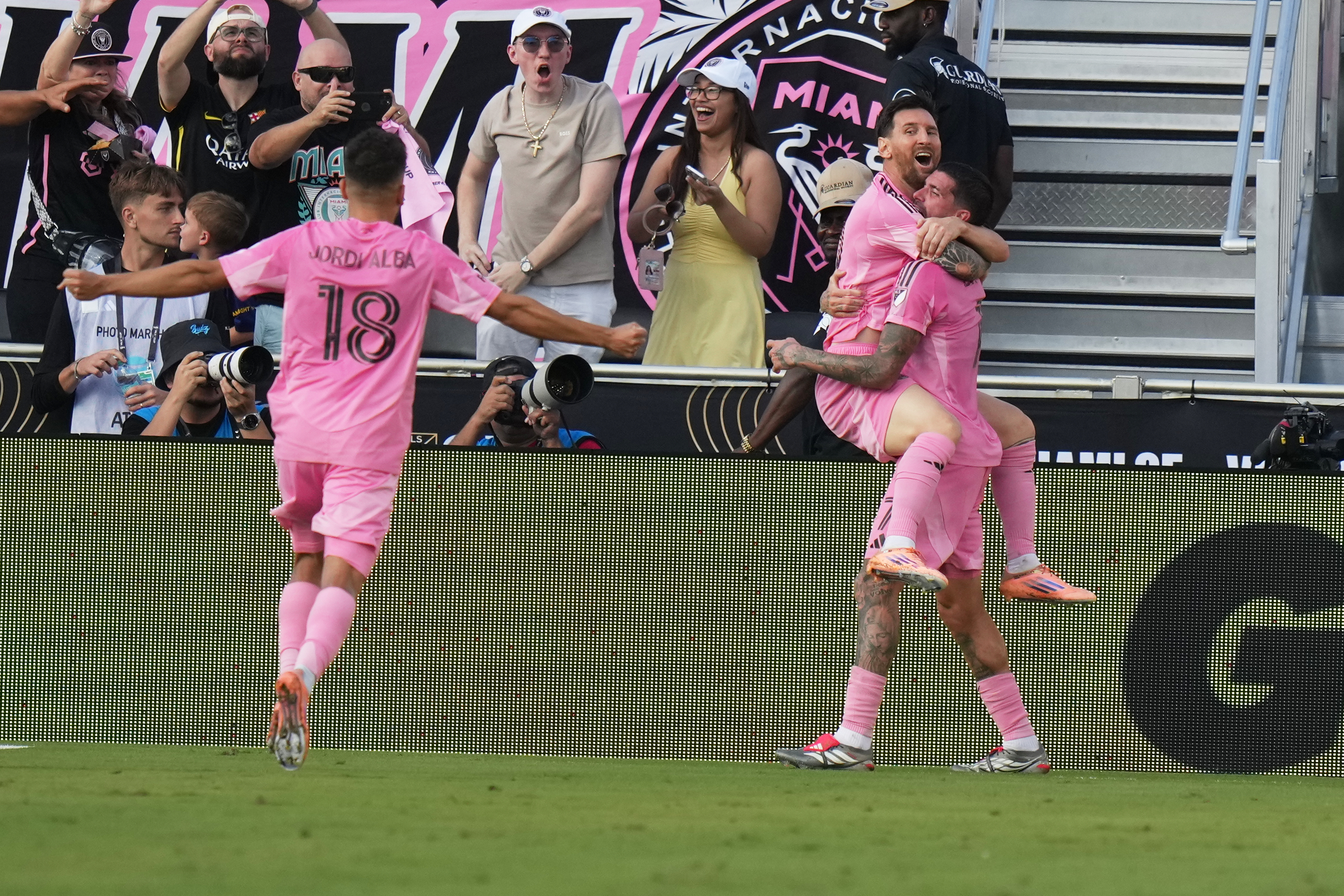 Inter Miami midfielder Rodrigo de Paul (7) celebrates a goal with forward Lionel Messi (10) and defender Jordi Alba (18) during the second half of the MLS Cup final soccer match against the Vancouver Whitecaps Saturday, Dec. 6, 2025, in Fort Lauderdale, Fla. 