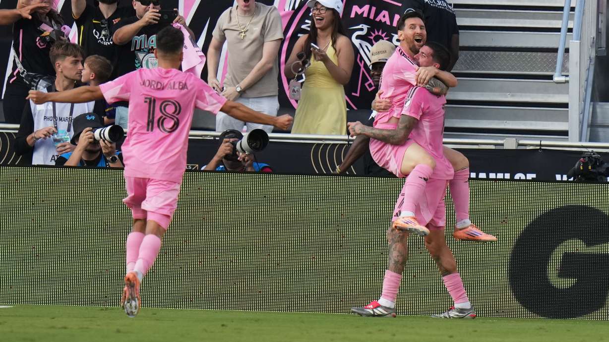 Inter Miami midfielder Rodrigo de Paul (7) celebrates a goal with forward Lionel Messi (10) and defender Jordi Alba (18) during the second half of the MLS Cup final soccer match against the Vancouver Whitecaps Saturday, Dec. 6, 2025, in Fort Lauderdale, Fla.