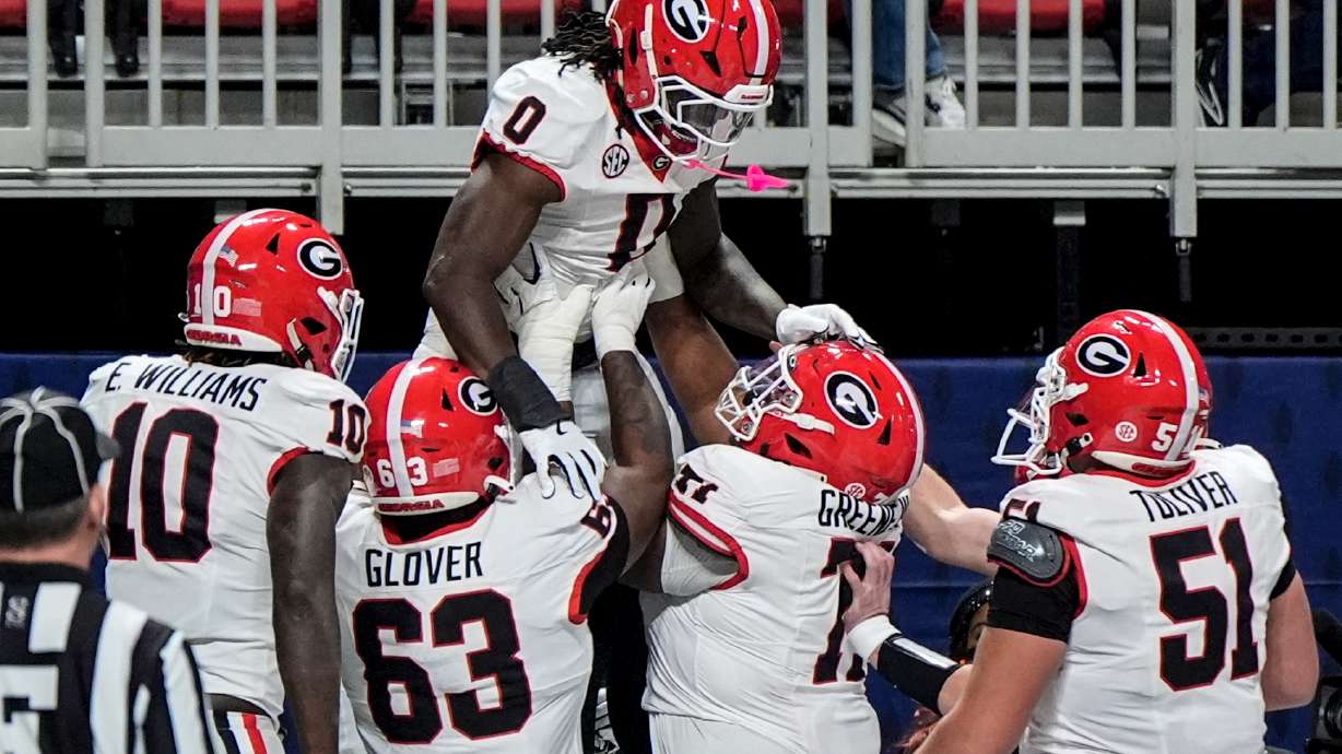 Georgia running back Roderick Robinson II (0) celebrates his touchdown against Alabama during the first half of a Southeastern Conference championship NCAA college football game, Saturday, Dec. 6, 2025, in Atlanta.