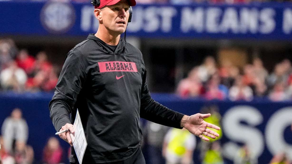 Alabama head coach Kalen Deboer speaks to an official during the first half of a Southeastern Conference championship NCAA college football game between Georgia and Alabama, Saturday, Dec. 6, 2025, in Atlanta.