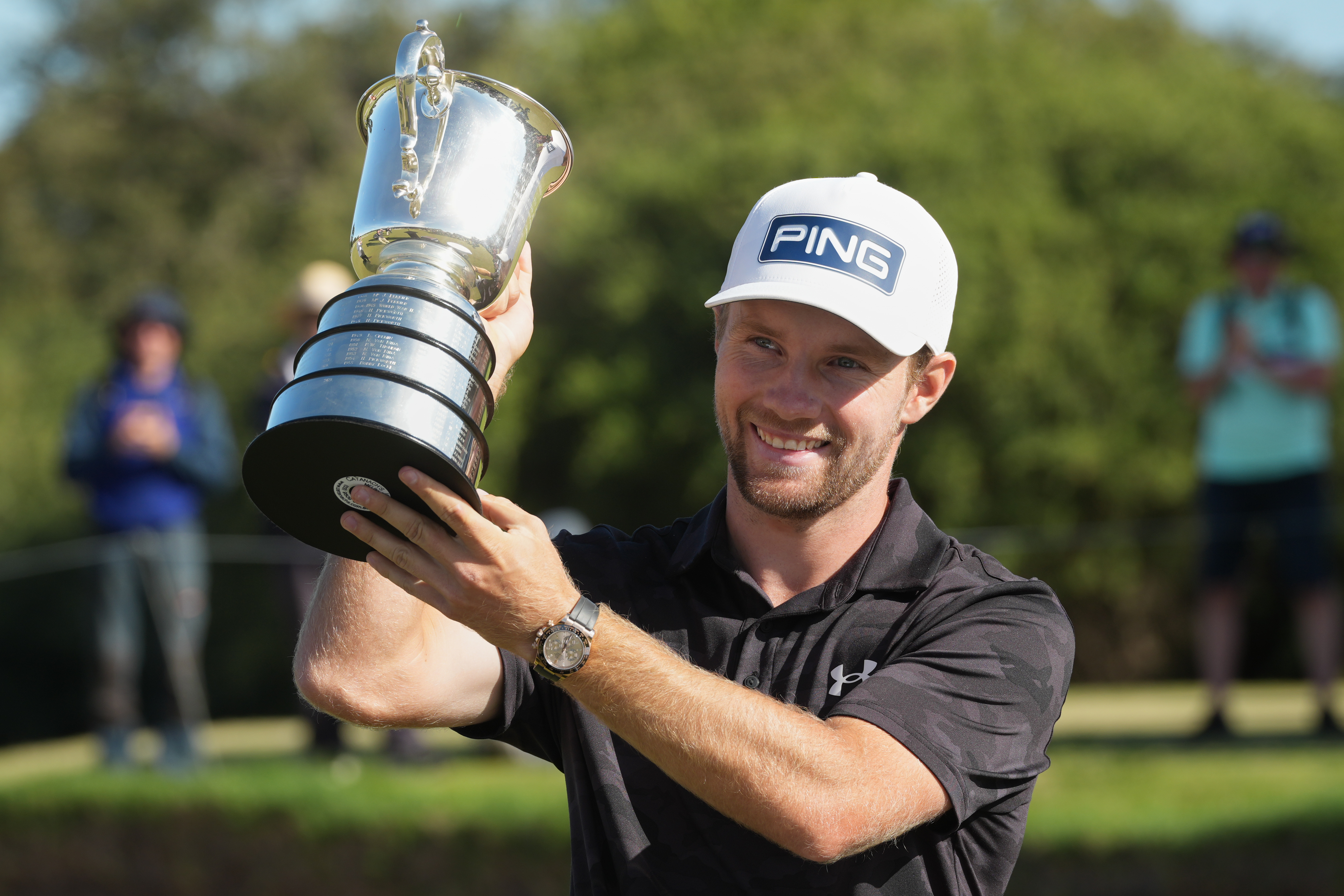 Denmark's Rasmus Neergaard-Petersen holds the Stonehaven Cup after winning the Australian Open golf tournament in Melbourne, Australia, Sunday, Dec. 7, 2025.