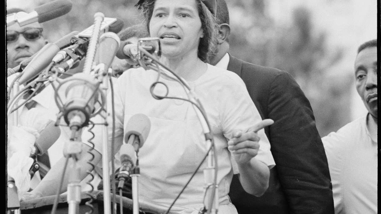 Rosa Parks delivers remarks in front of the Alabama State Capitol at the conclusion of the 54 mile march from Selma to Montgomery. Alabama State Capitol, Montgomery, Ala., March 25, 1965.