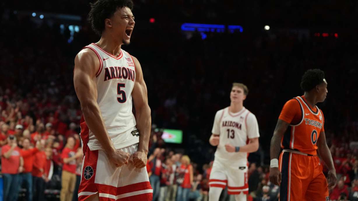 Arizona guard Brayden Burries (5) reacts after scoring against Auburn during the second half of an NCAA college basketball game, Saturday, Dec. 6, 2025, in Tucson, Ariz.