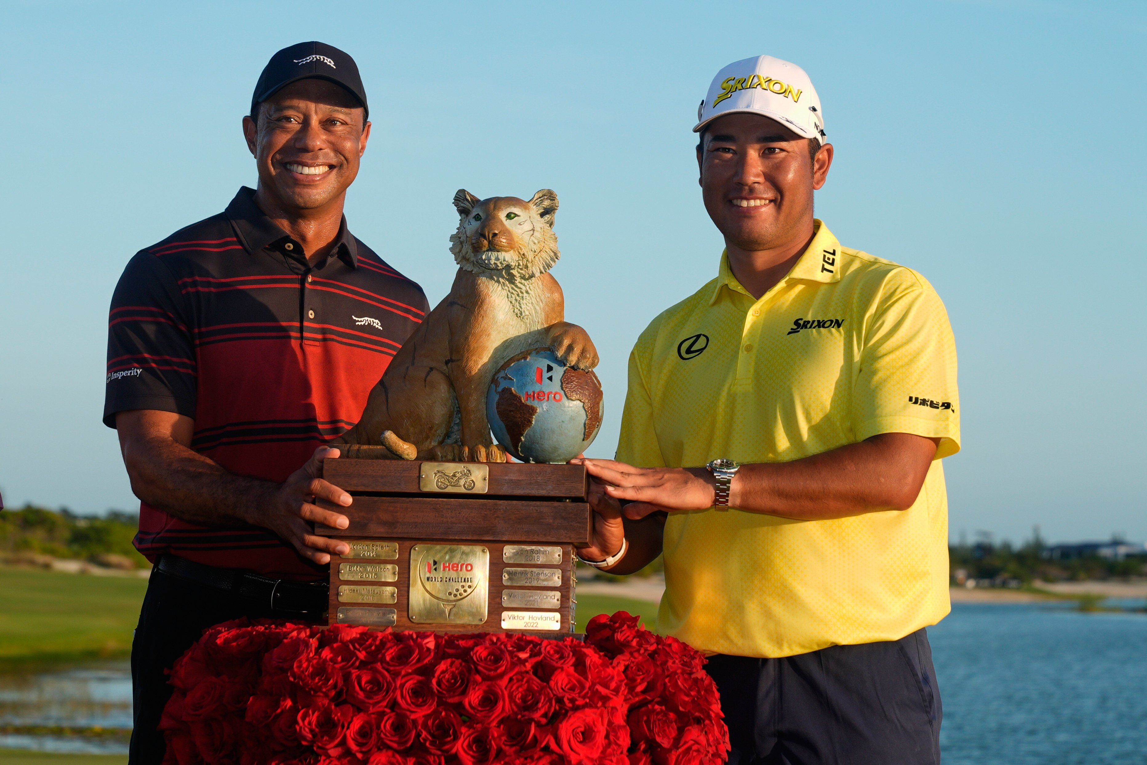 Hideki Matsuyama, of Japan, right, poses for a photo with golf legend Tiger Woods after winning the Hero World Challenge PGA Tour at the Albany Golf Club, in New Providence, Bahamas, Sunday, Dec. 7, 2025.