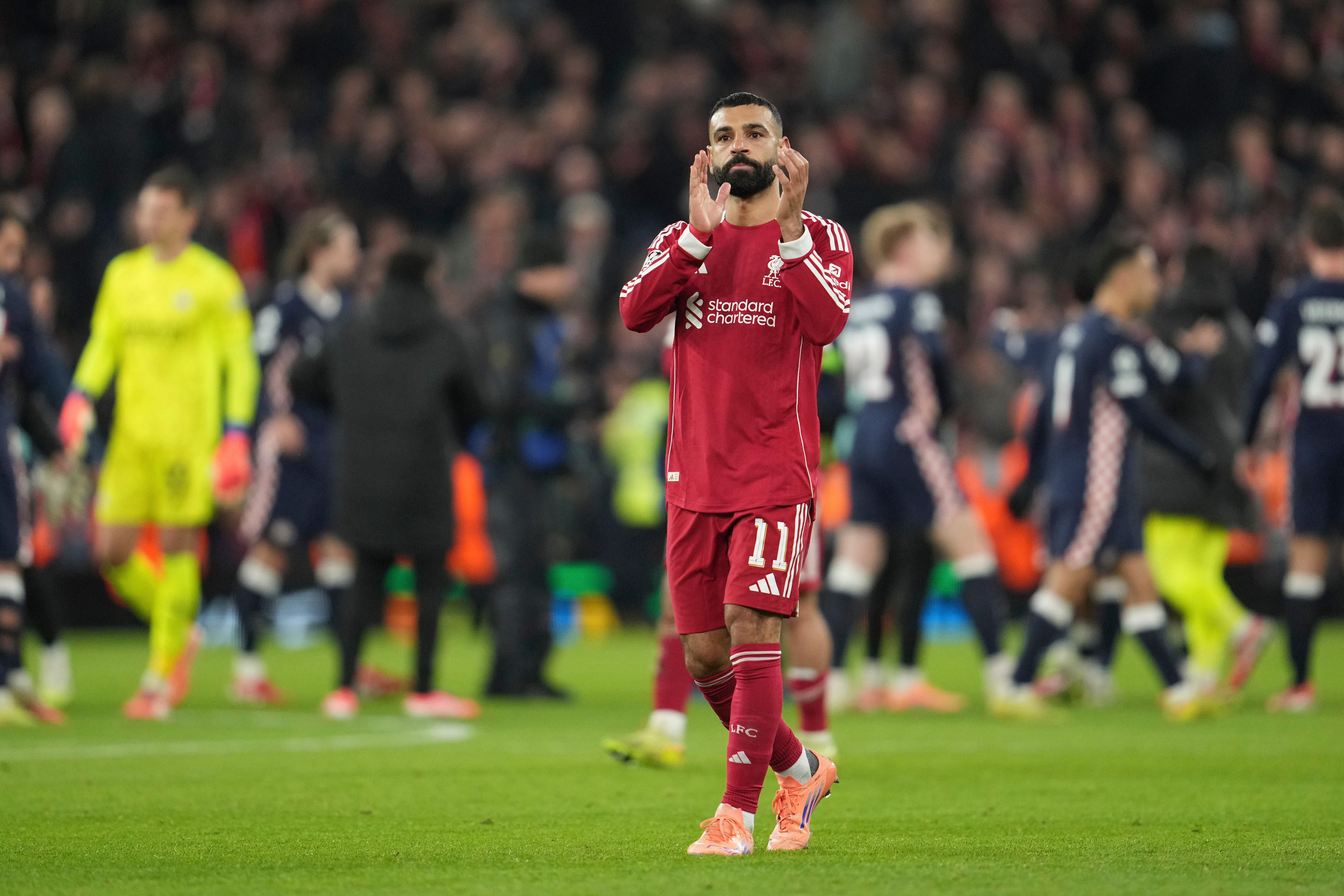 Liverpool's Mohamed Salah applauds after the Champions League opening phase soccer match between Liverpool and PSV in Liverpool, England, Wednesday, Nov. 26, 2025. 