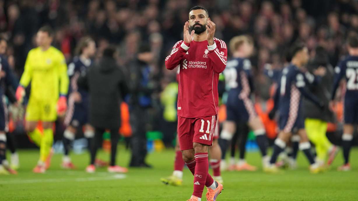 Liverpool's Mohamed Salah applauds after the Champions League opening phase soccer match between Liverpool and PSV in Liverpool, England, Wednesday, Nov. 26, 2025.
