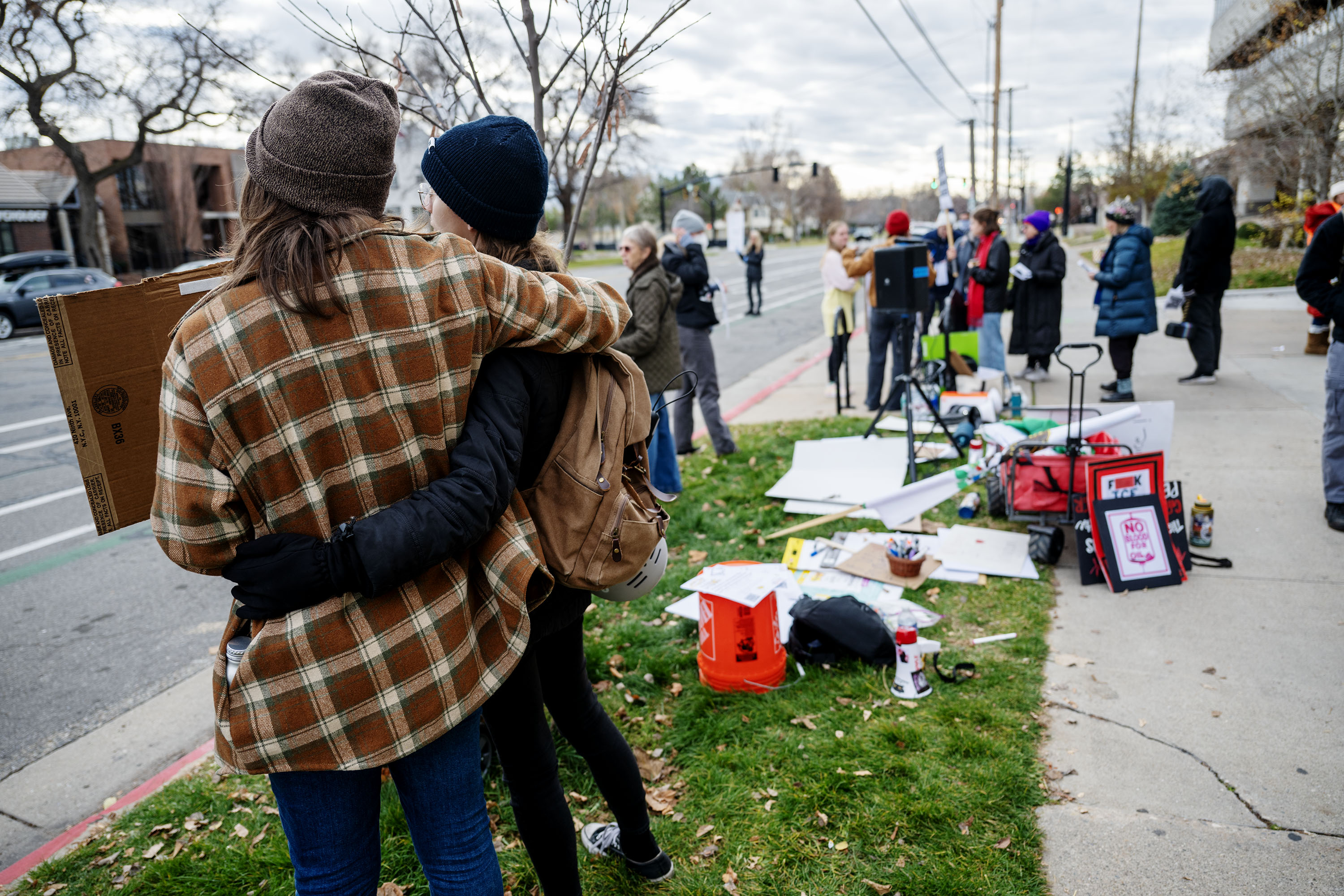 Protesters gather in front of the U.S. Citizenship and Immigration Services field office in Salt Lake City on Monday.