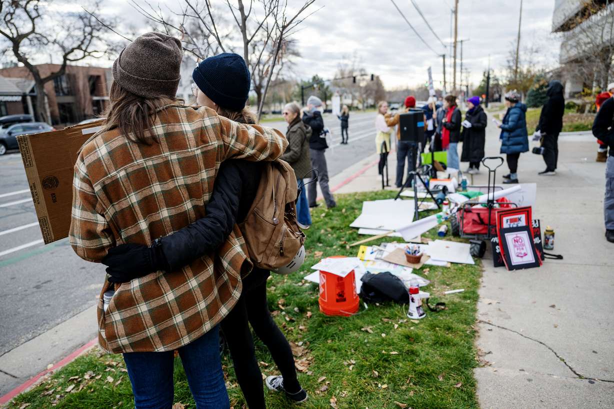 Protesters gather in front of the U.S. Citizenship and Immigration Services field office in Salt Lake City on Monday.