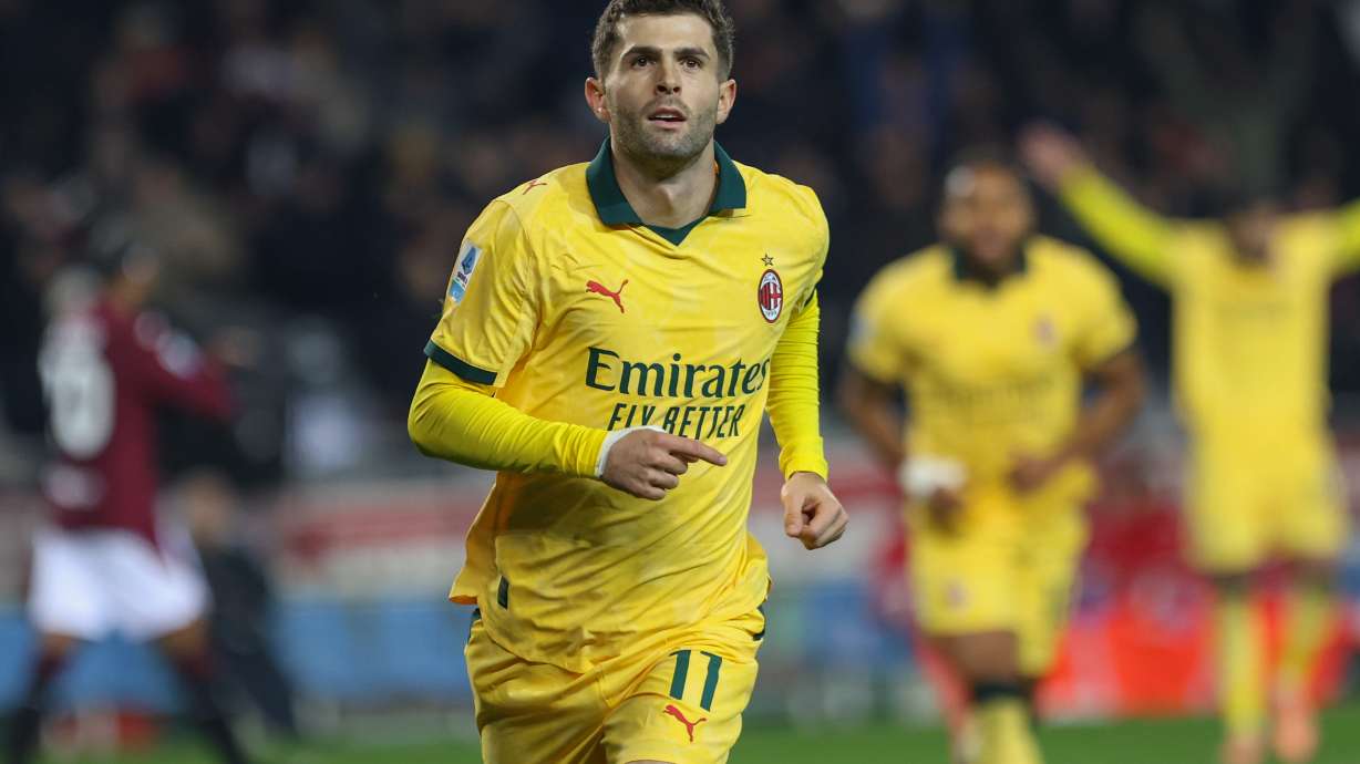 Milan's Christian Pulisic celebrates after scoring a goal during the Serie A soccer match between Torino FC and Milan in Turin, Italy, Monday, Dec. 8, 2025.