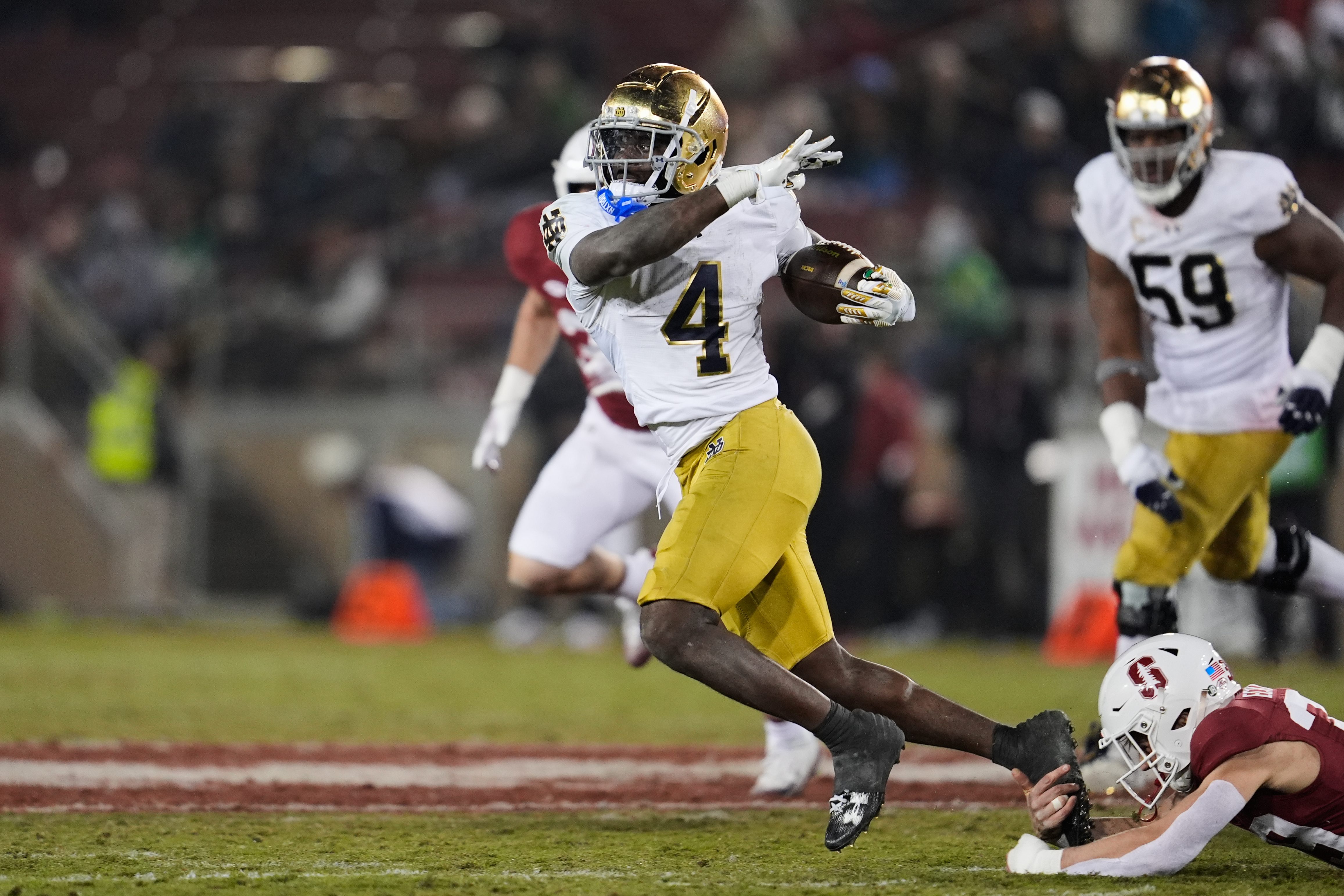 Notre Dame running back Jeremiyah Love (4) is tackled by Stanford safety Charlie Eckhardt (39) during the second half of an NCAA college football game, Saturday, Nov. 29, 2025, in Stanford, Calif. 