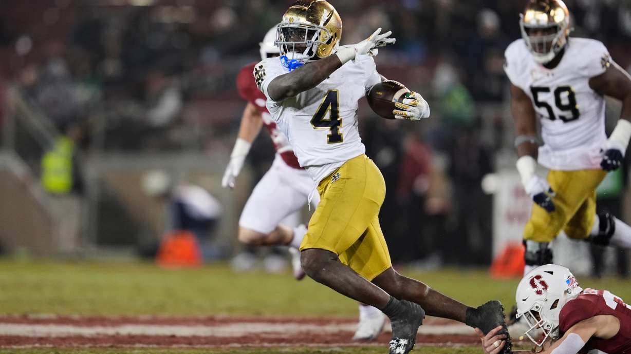 Notre Dame running back Jeremiyah Love (4) is tackled by Stanford safety Charlie Eckhardt (39) during the second half of an NCAA college football game, Saturday, Nov. 29, 2025, in Stanford, Calif.