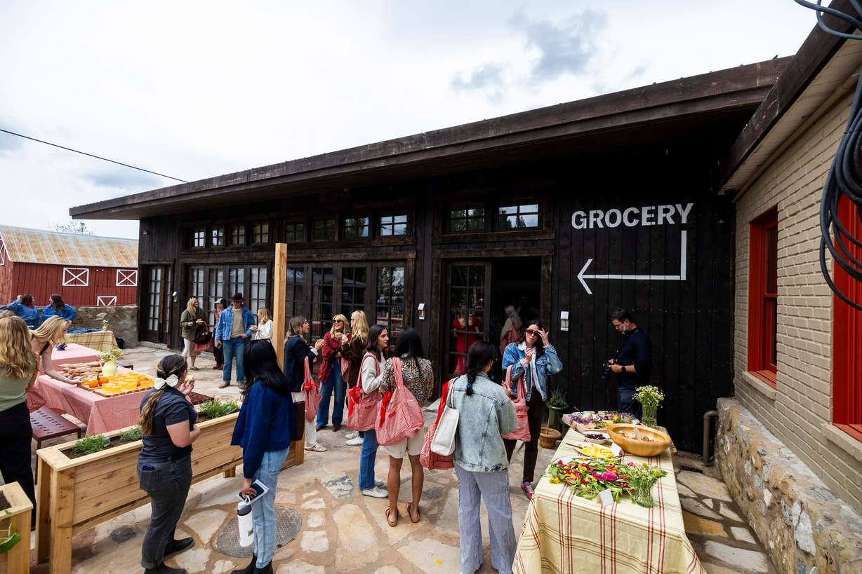 Media and guests sample food at the media day for Ballerina Farm’s new farm store in Midway on May 16.
