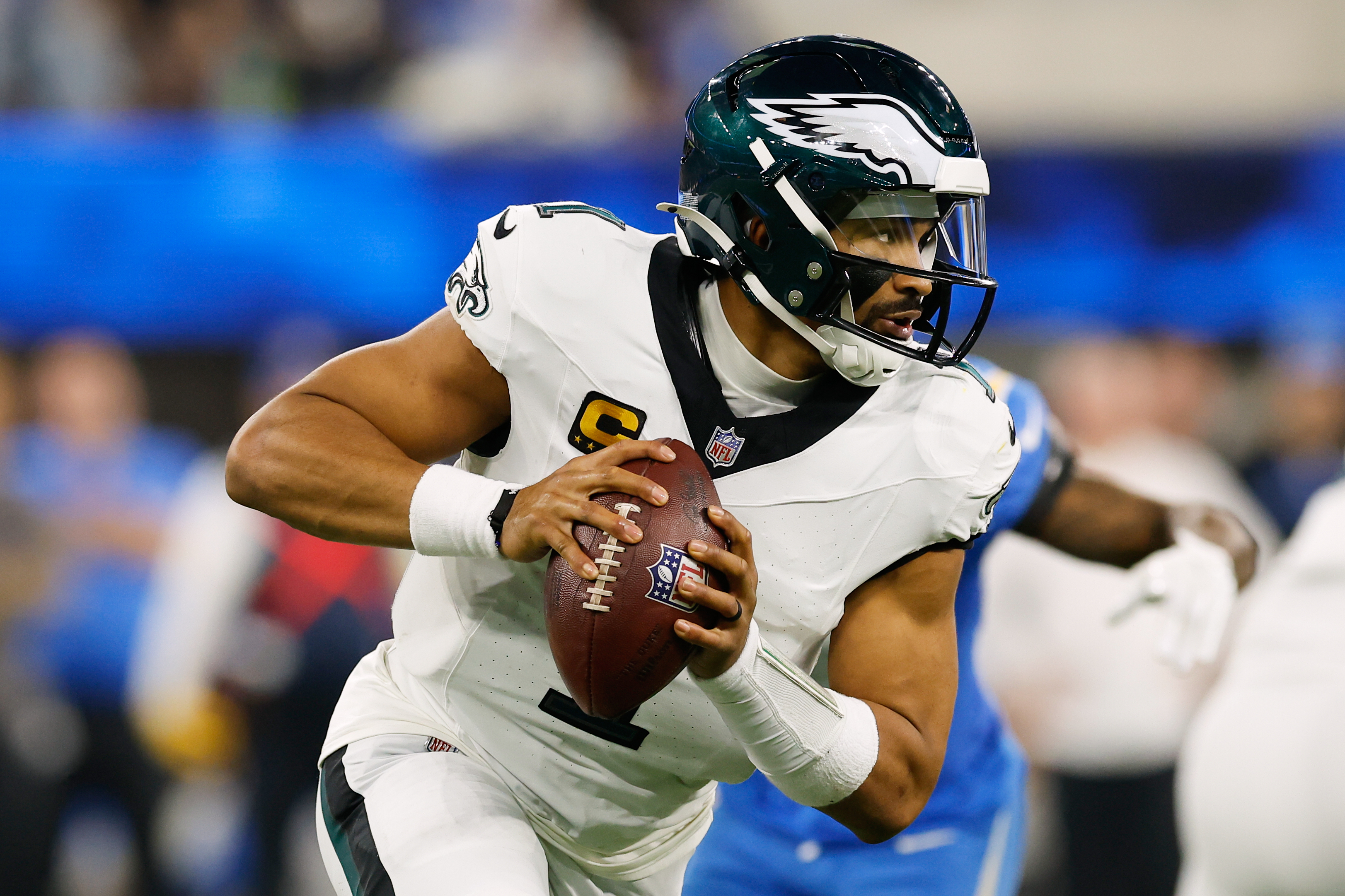 Philadelphia Eagles quarterback Jalen Hurts (1) rolls out during the second half of an NFL football game against the Los Angeles Chargers, Monday, Dec. 8, 2025, in Inglewood, Calif. 