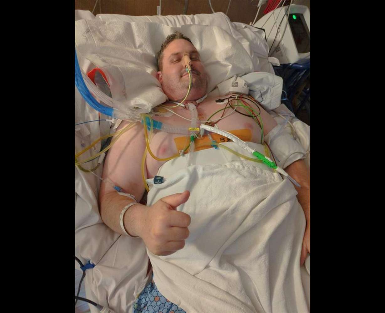 Benjamin Phelps in the hospital. Phelps, who was wounded in the Sept. 28 attack on a Church of Jesus Christ meetinghouse in Michigan, endured 25 surgeries.