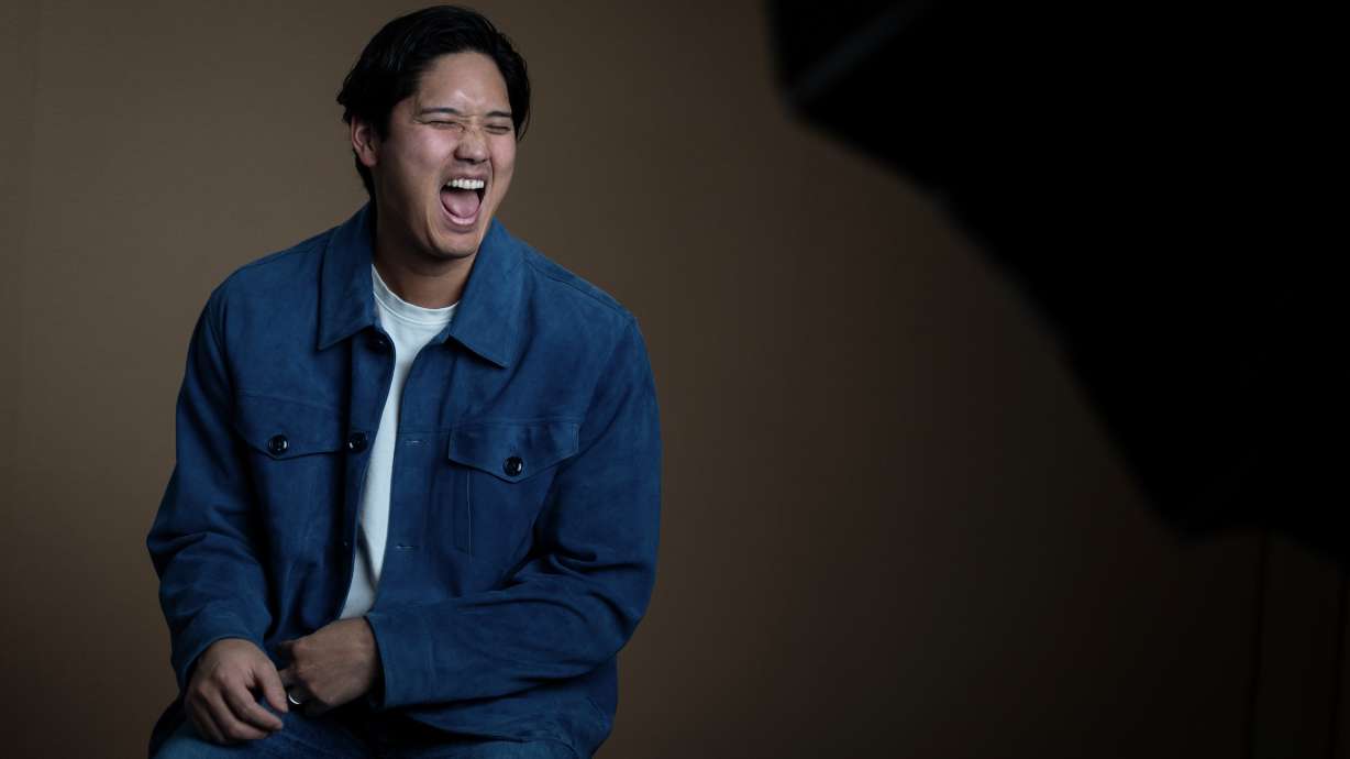 Los Angeles Dodgers' Shohei Ohtani shares a laugh with his translator during an interview with The Associated Press in Pasadena, Calif., Wednesday, Nov. 26, 2025.