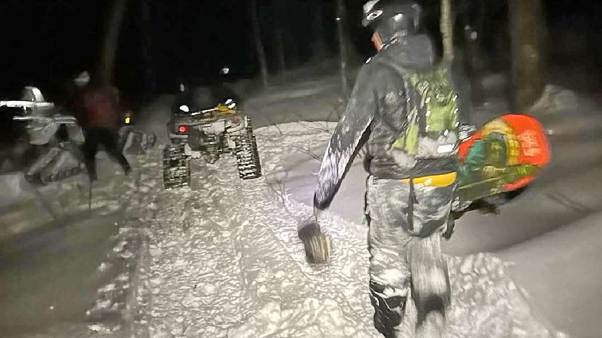 In this photo released by the Stowe Mountain Rescue, Stowe Mountain Rescue responses to a 911 call from a lost skier and snowboarder in the backcountry outside Stowe Mountain Resort on Nov. 29, 2025 in Stowe, Vt.