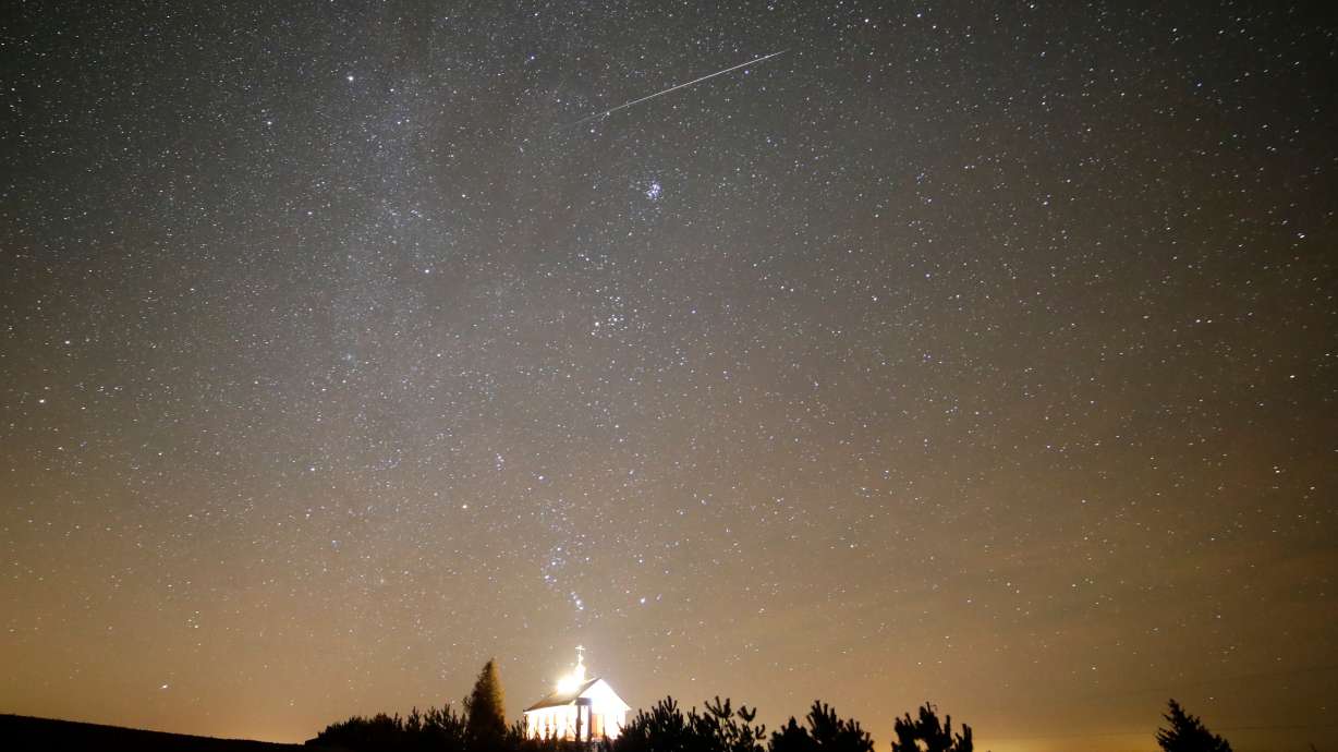 A meteor streaks over an Orthodox church during the annual Geminid meteor shower near the village of Zagorie, some 69 miles west of Minsk, Belarus, Dec. 13, 2017.