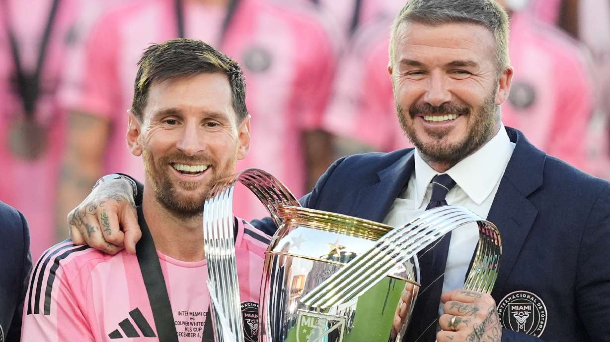 David Beckham poses with the MLS Cup trophy with Inter Miami forward Lionel Messi Saturday, Dec. 6, 2025, in Fort Lauderdale, Fla.
