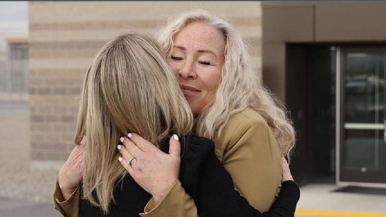 Nannette Wride-Zeeman hugs family members outside the parole hearing for Meagan Dakota Grunwald, convicted of manslaughter for her role in the death of Utah County Sheriff's Sgt. Cory Wride in 2014.