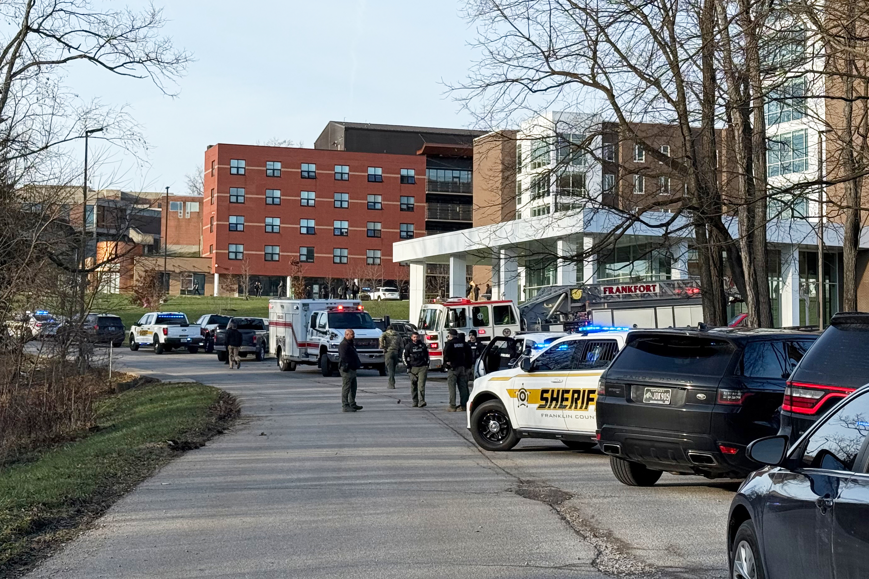 Law enforcement responds to a shooting at Whitney Moore Young Jr. Hall on Kentucky State University's campus in Frankfort, Ky., Tuesday. One person was dead, one was hurt, and a suspect is in custody, police said.