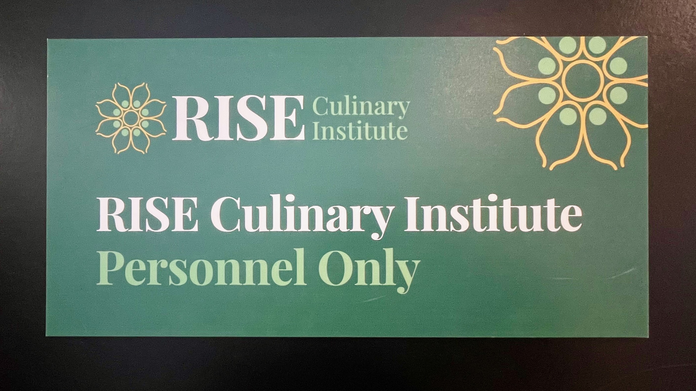 Lavanya Mahate runs the nonprofit RISE Culinary Institute to empower immigrant and refugee women and help them learn kitchen skills. A sign at the RISE facility in Salt Lake City is pictured Dec. 2.