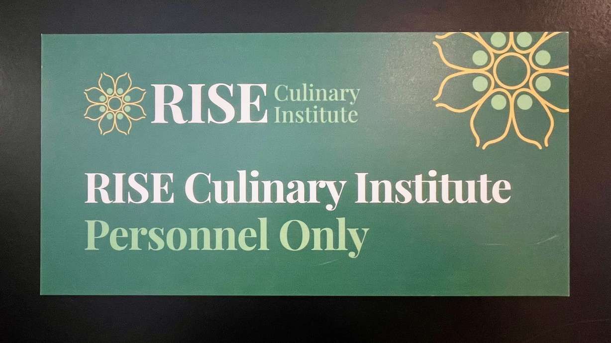 Lavanya Mahate runs the nonprofit RISE Culinary Institute to empower immigrant and refugee women and help them learn kitchen skills. A sign at the RISE facility in Salt Lake City is pictured Dec. 2.