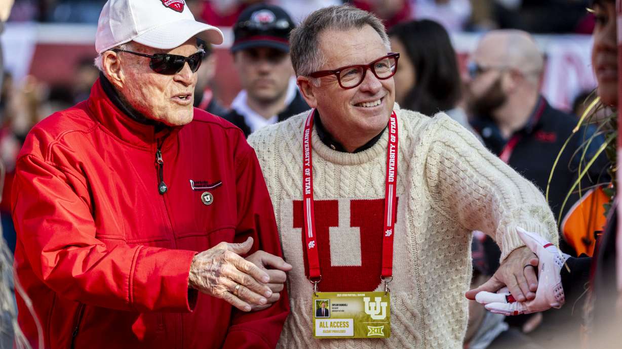 Spencer F. Eccles, George S. and Dolores Doré Eccles Foundation chairman and CEO, and University of Utah President Taylor Randall greet graduating Utah seniors before an NCAA football game against the Kansas State Wildcats at Rice-Eccles Stadium in Salt Lake City on Saturday, Nov. 22, 2025.