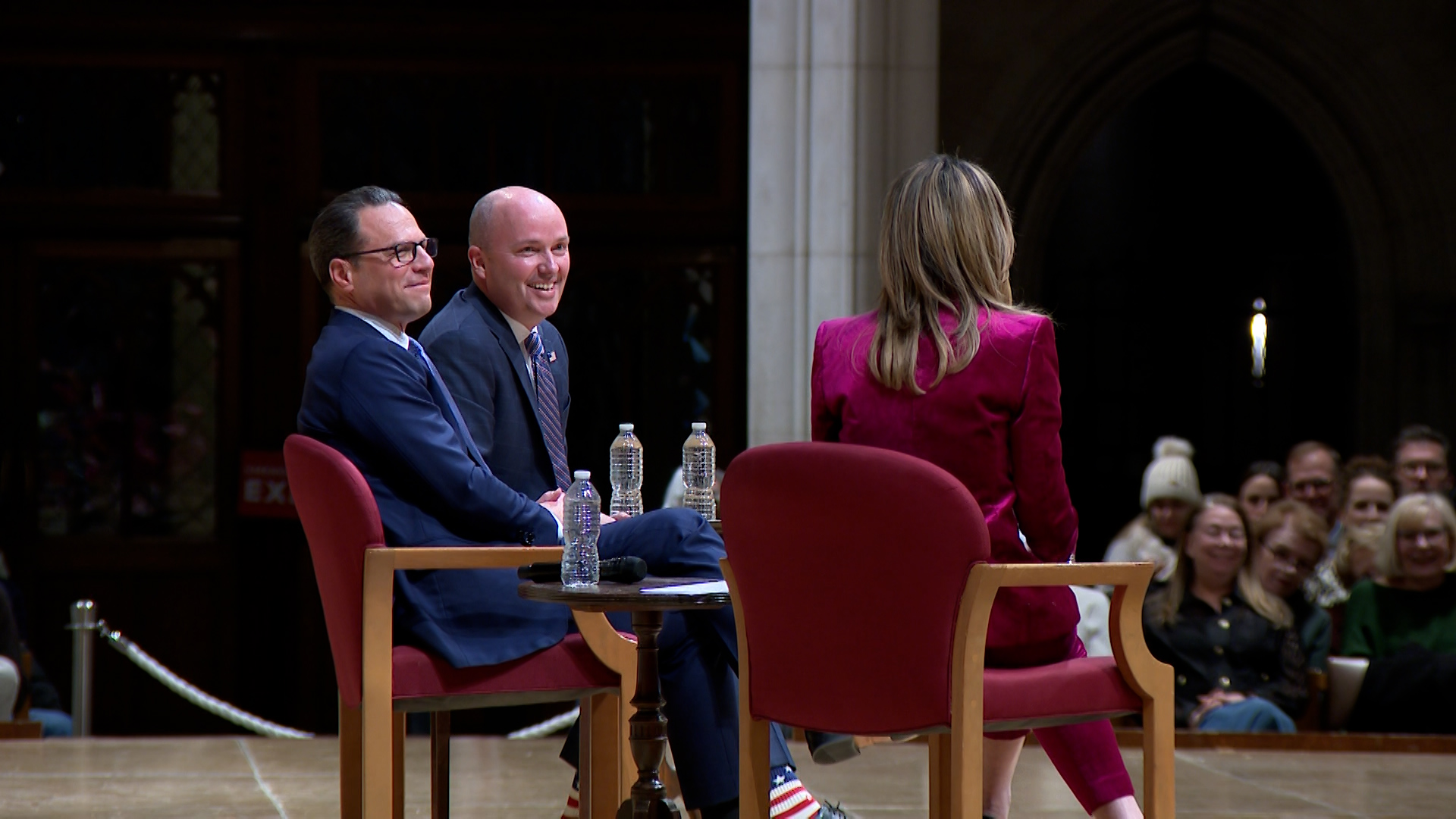 Gov. Spencer Cox, center, speaks at an event at Washington National Cathedral with Pennsylvania Gov. Josh Shapiro, left, and NBC anchor Savannah Guthrie, right.