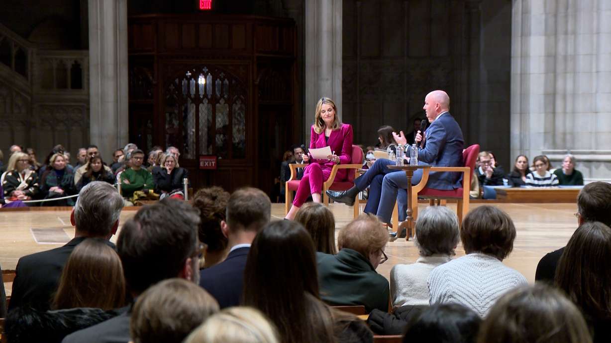 Utah Gov. Spencer Cox, right, speaks at an event at Washington National Cathedral with Pennsylvania Gov. Josh Shapiro and NBC anchor Savannah Guthrie.