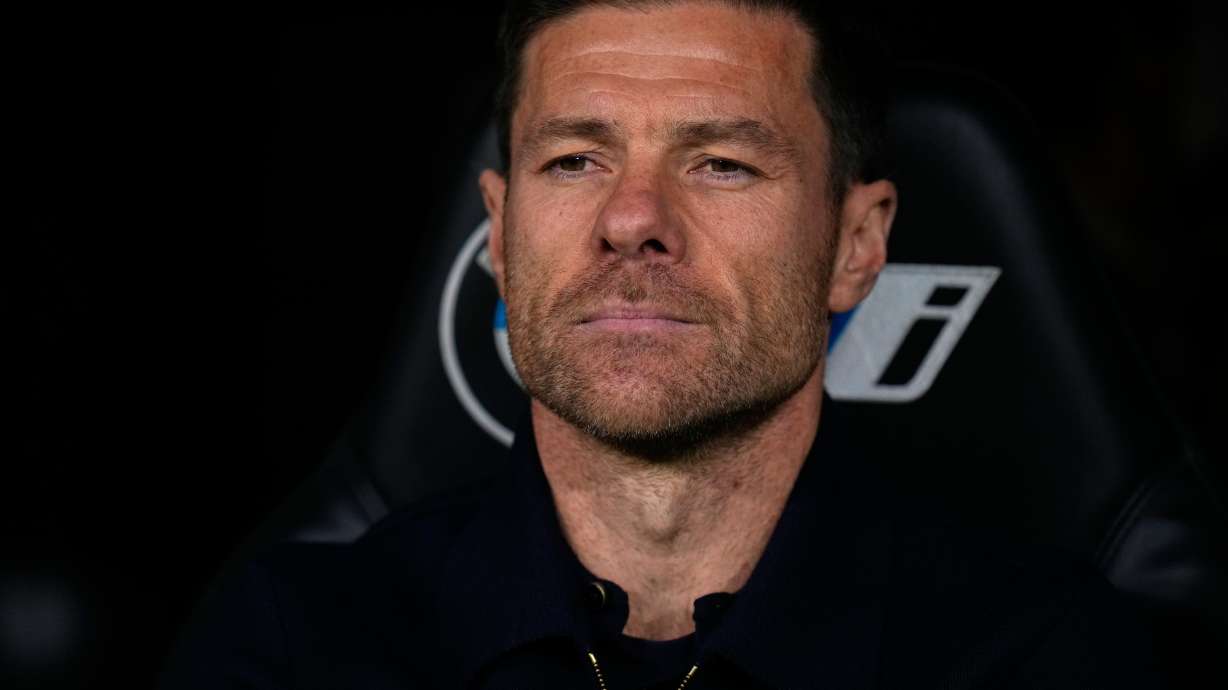 Real Madrid's head coach Xabi Alonso takes his seat on the bench before the Spanish La Liga soccer match between Real Madrid and Celta Vigo in Madrid, Spain, Sunday, Dec. 7, 2025.