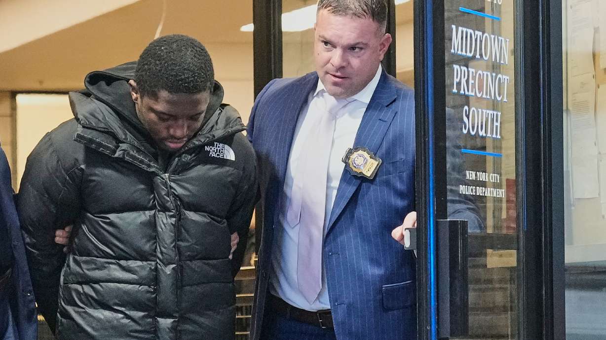 Frederick Green, 20, of The Bronx borough of New York, charged with attempted murder in the shooting of New York Jets' player Kris Boyd, is escorted from the Midtown South Police Precinct, in New York, Tuesday, Dec. 9, 2025.